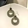 A new, minimalist pearl stud earrings featuring a unique European and American retro fashion style with shiny leather. They are trendy on Instagram for women, exuding a cool and stylish vibe details Picture